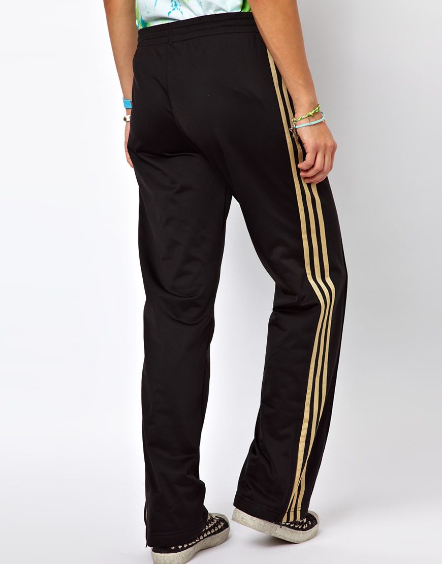 gold adidas track pants