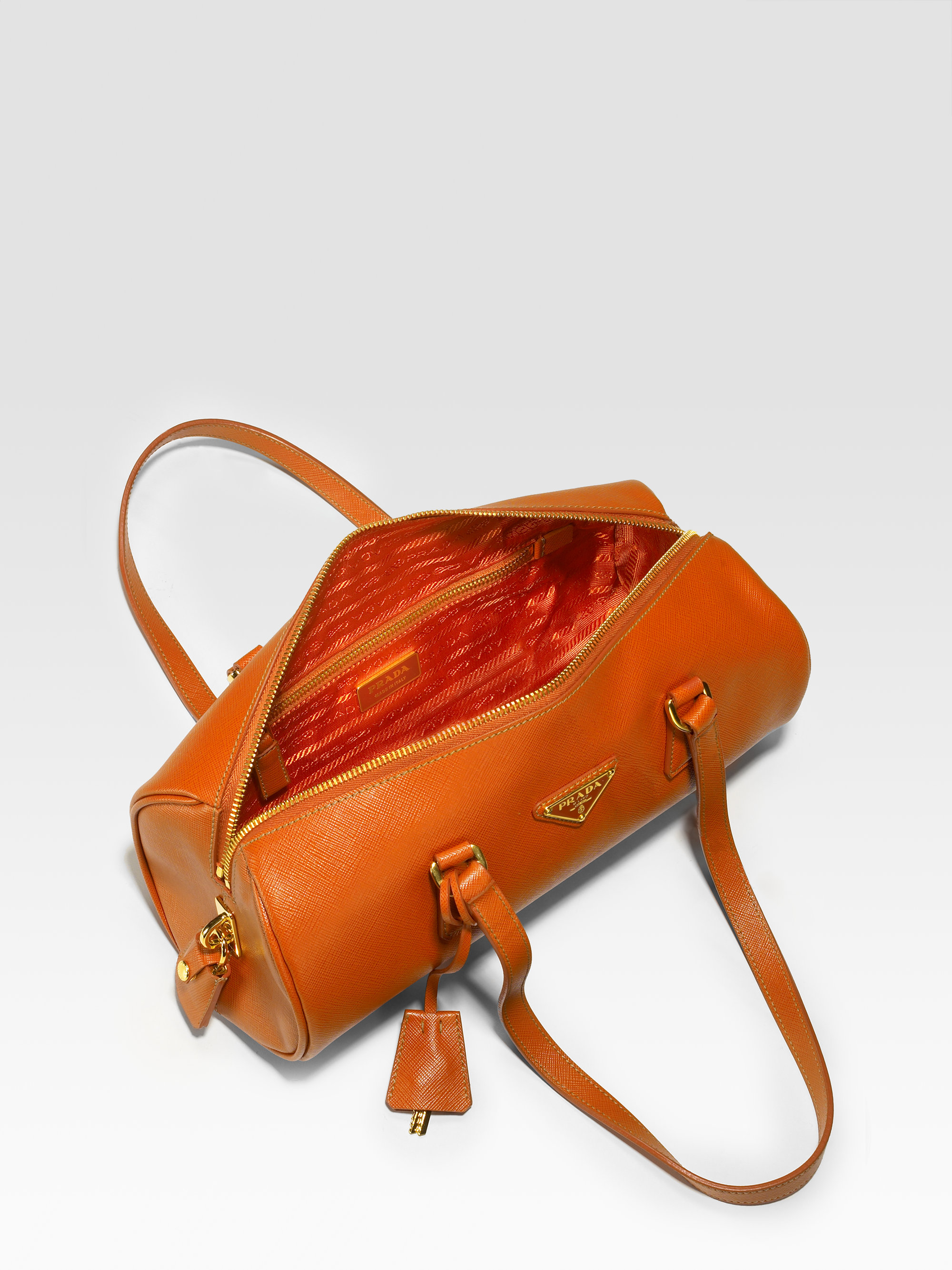 Prada Mini Saffiano Roll Bag in Black (Orange) - Lyst