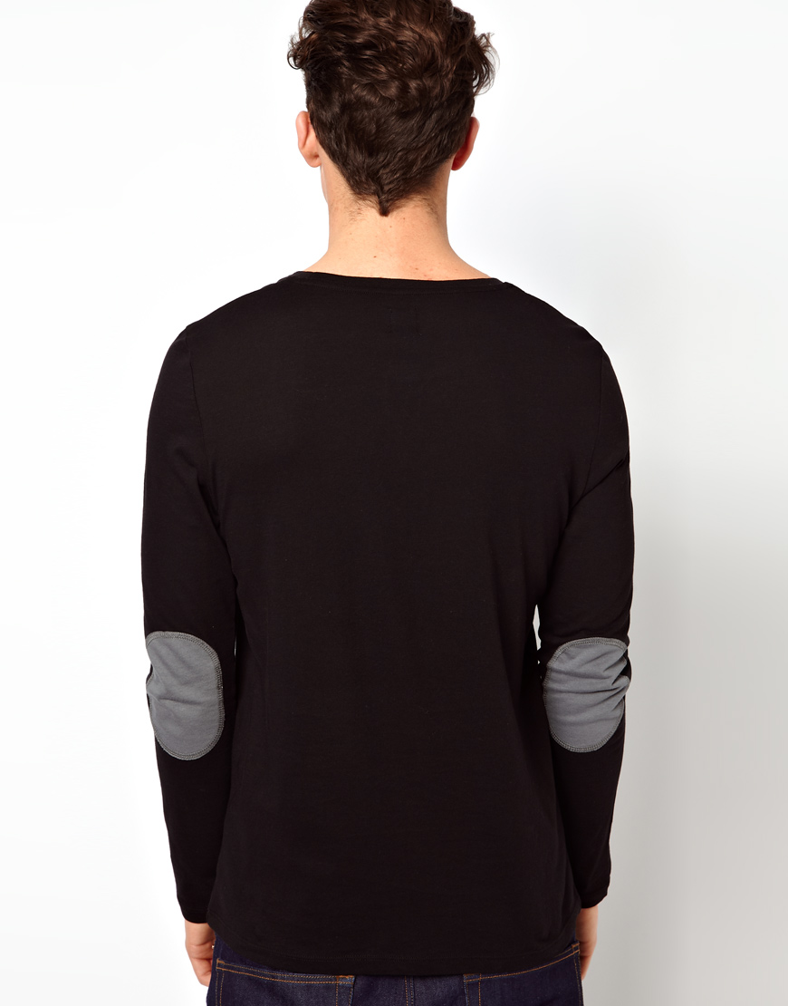 black shirt with elbow patch