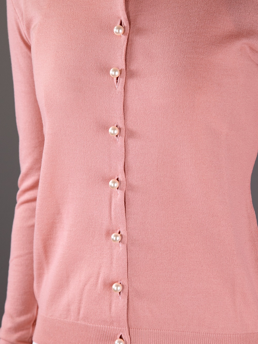 pink cardigan with pearl buttons
