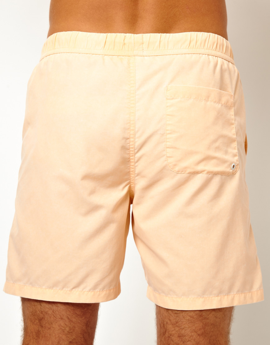 peach swim shorts