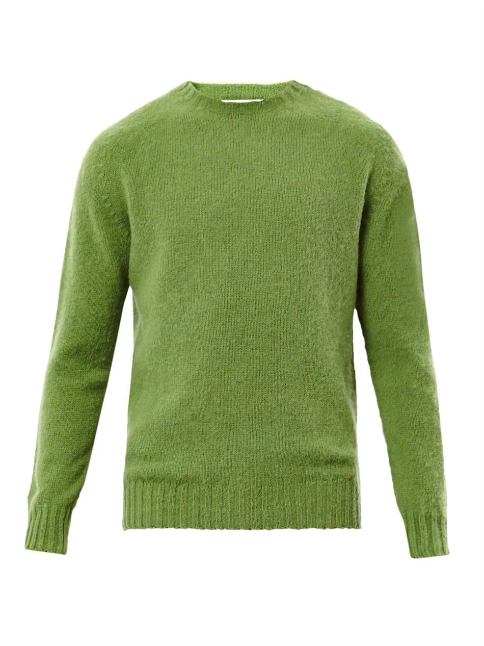 green sweater blue pants