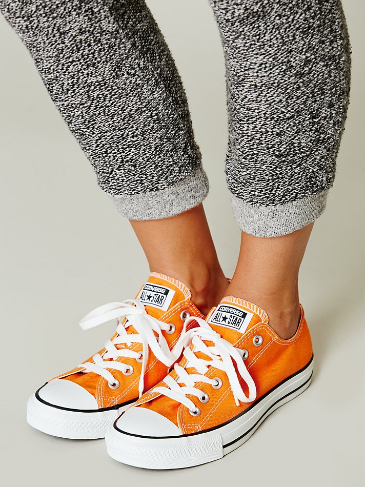 white converse orange bottoms