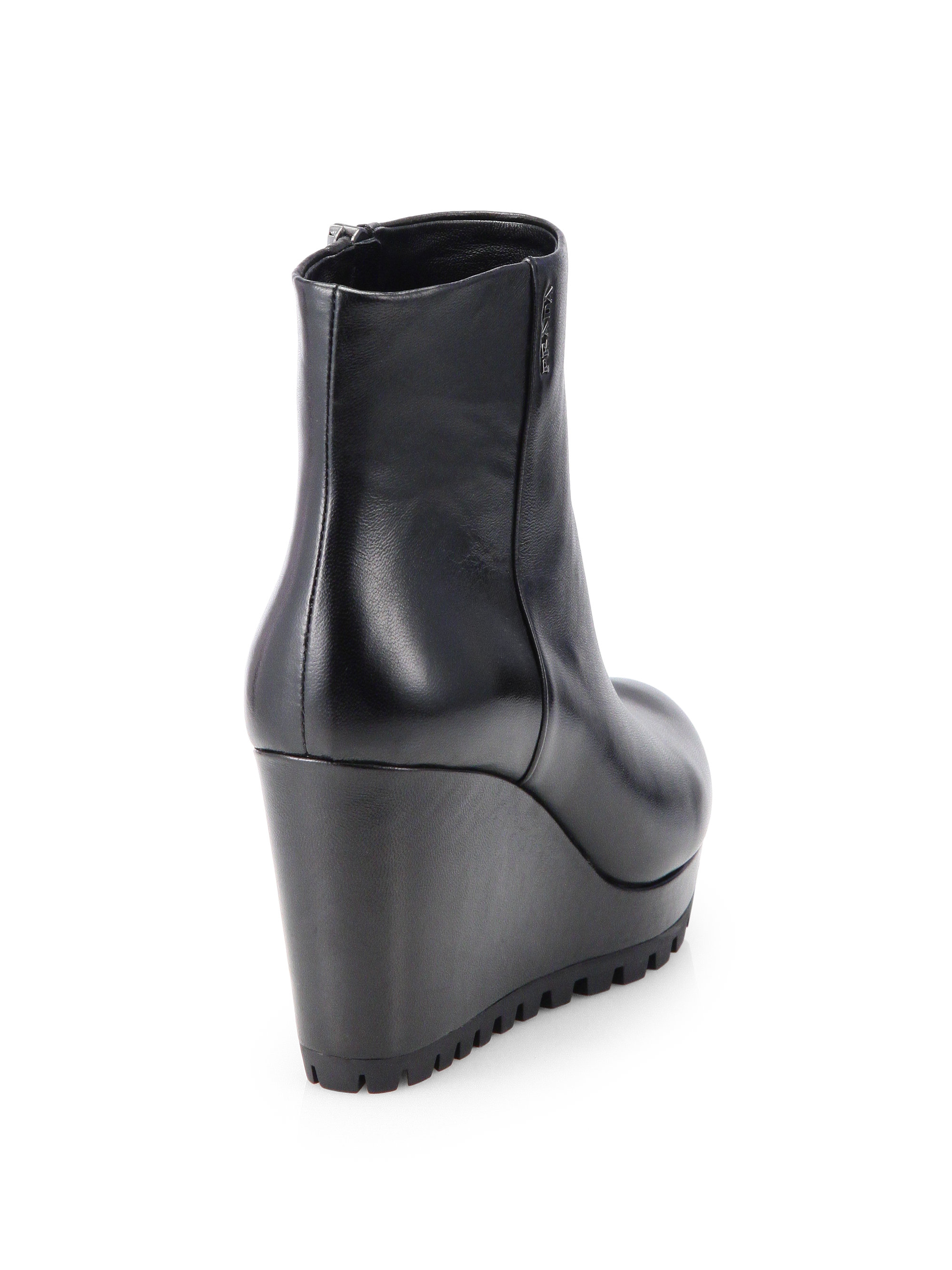 Prada Leather Wedge Ankle Boots in Black - Lyst