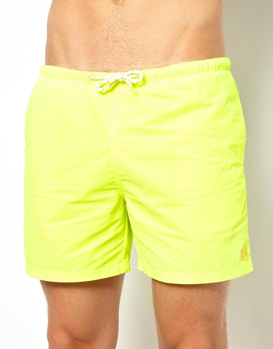 neon yellow swim trunks