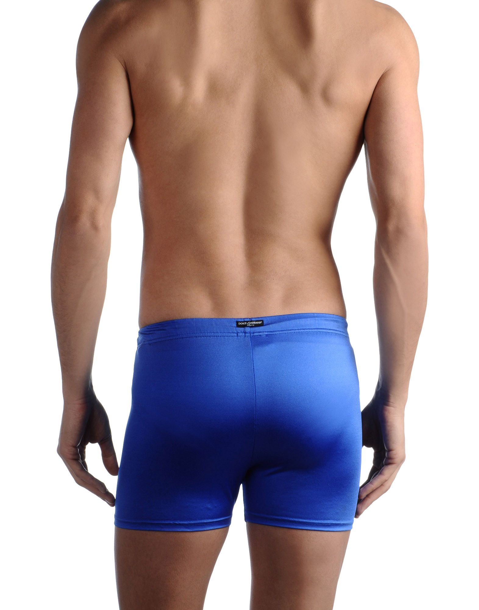 Zappos Footer Swim trunks with a printed motif. Elasticized drawstring waistband and lined front.