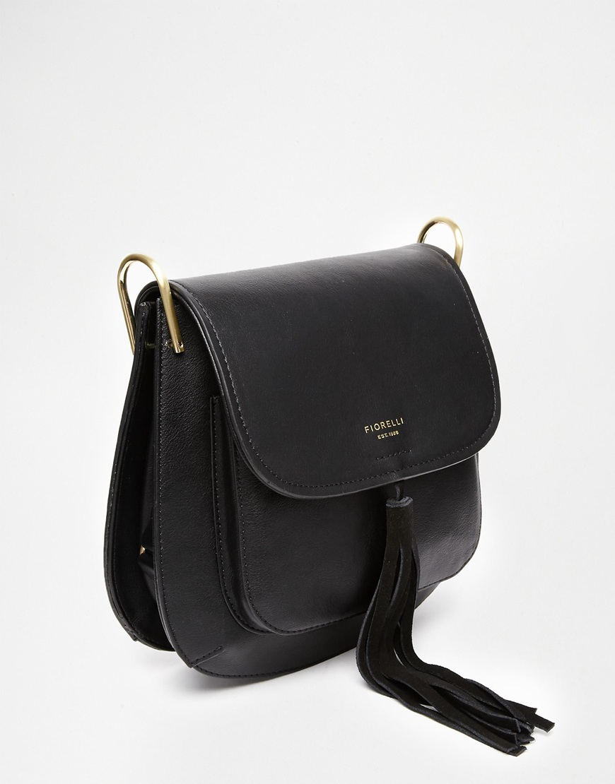 Lyst Fiorelli Nikita Saddle Bag With Tassel Detail In Black Be Inspired