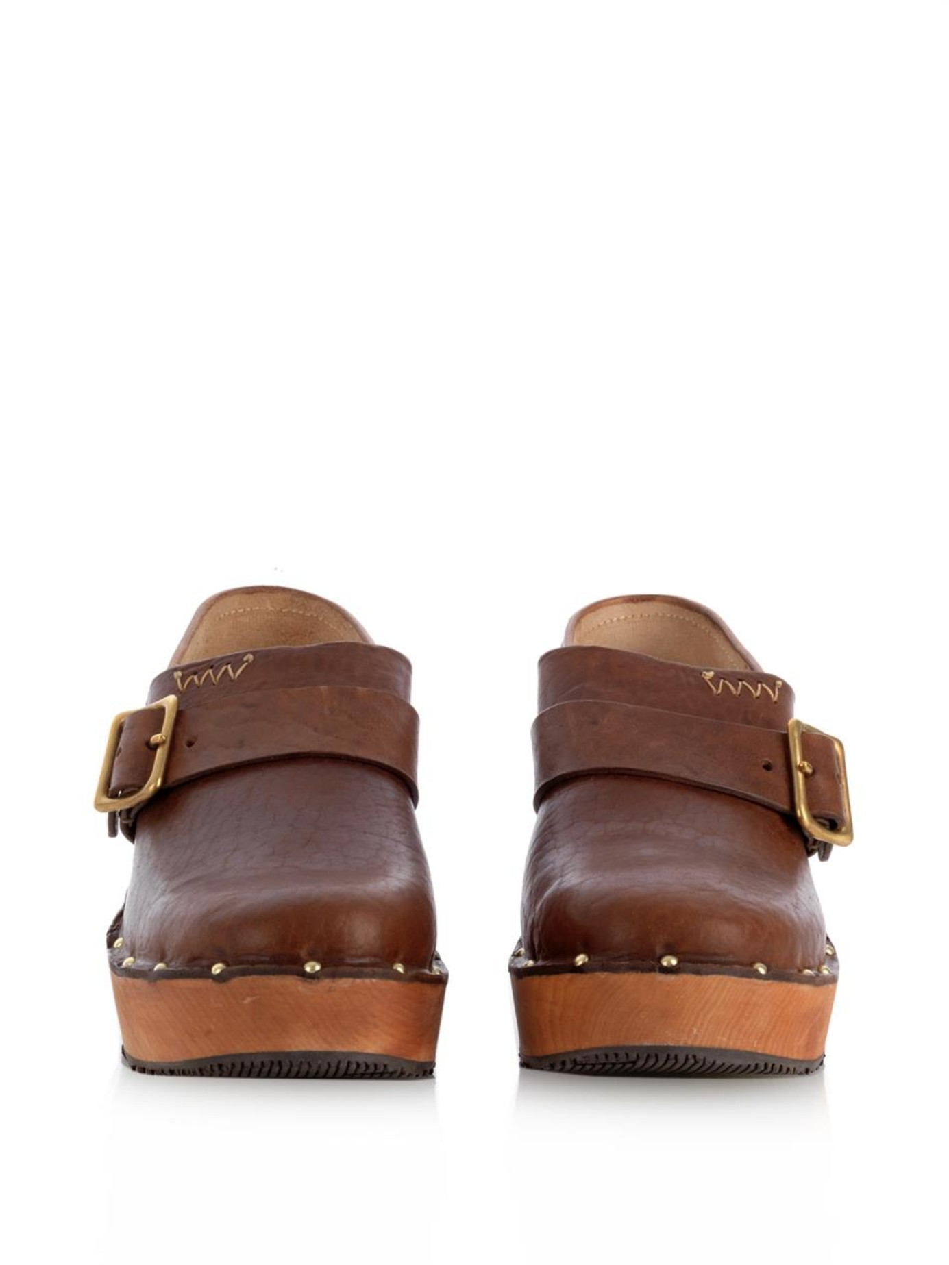 brown leather clogs