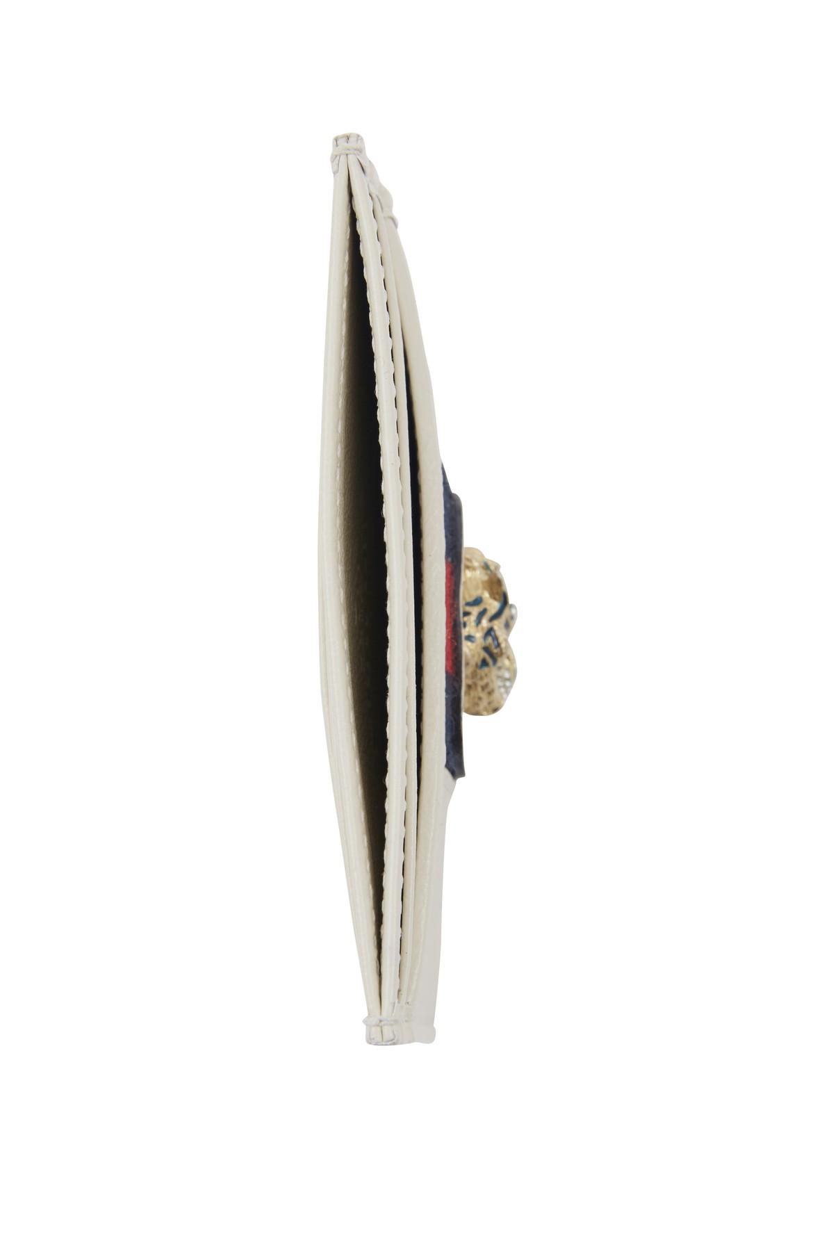 white rhyton gucci logo trainers