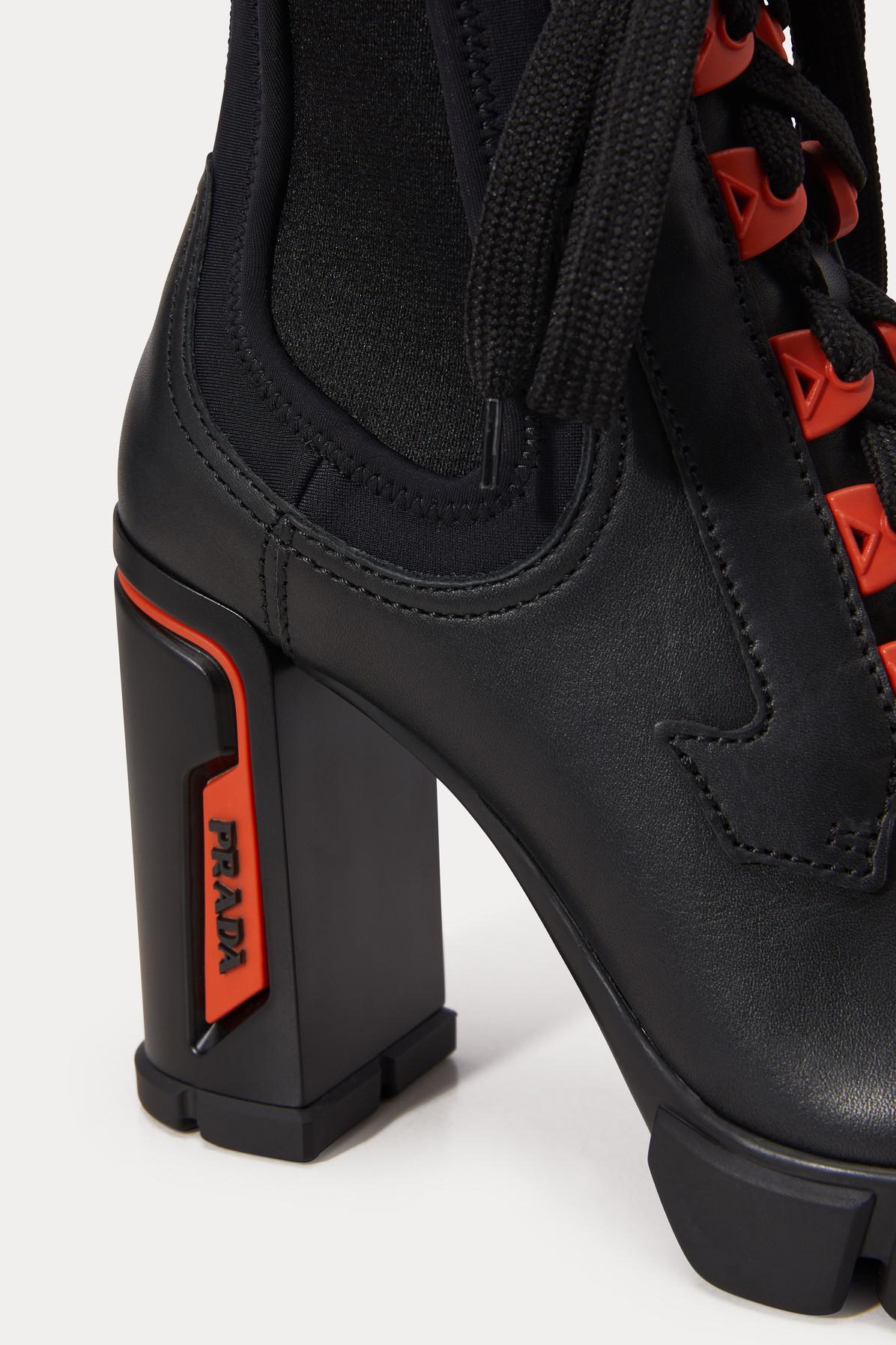 black and orange prada boots