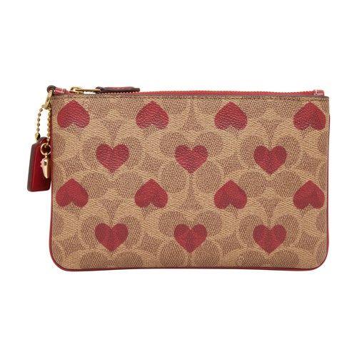 Buy the Coach Heart Print Small Wristlet Pink