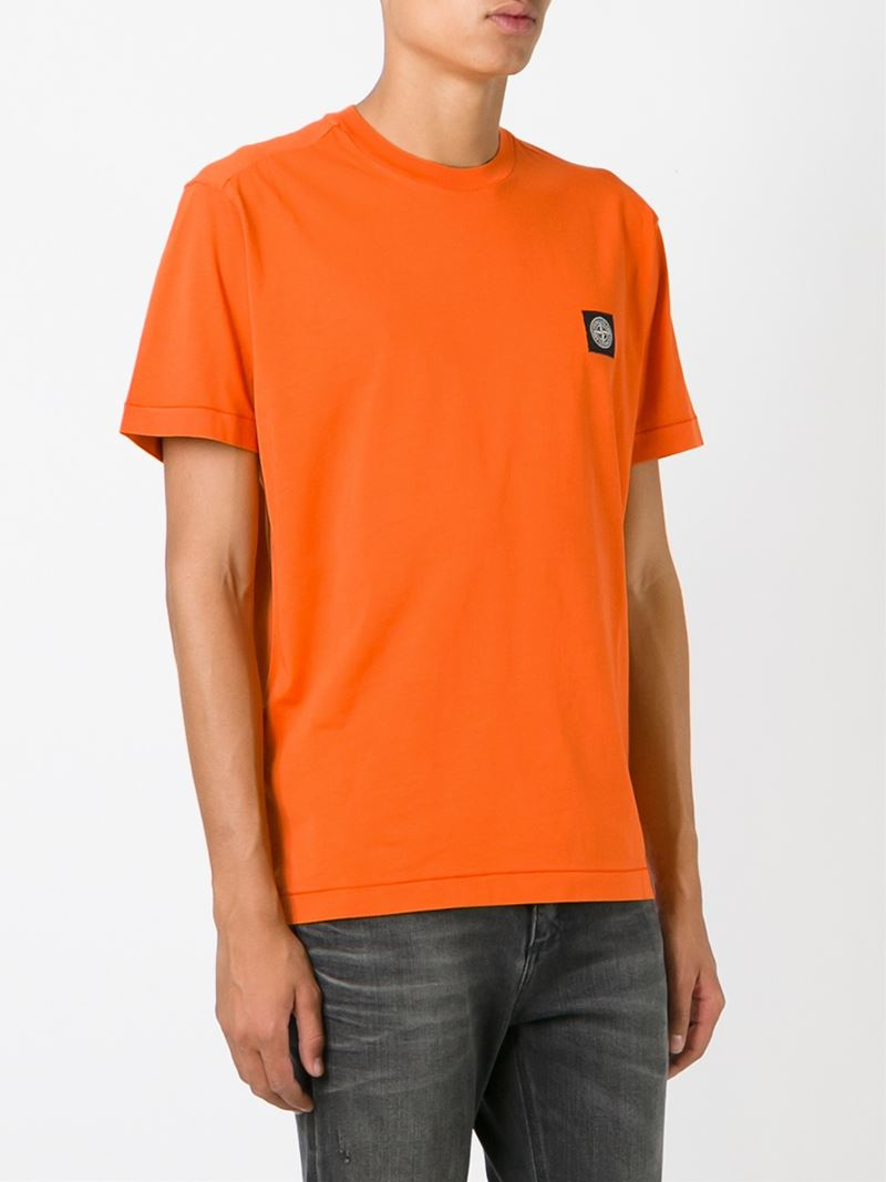 orange stone island t shirt