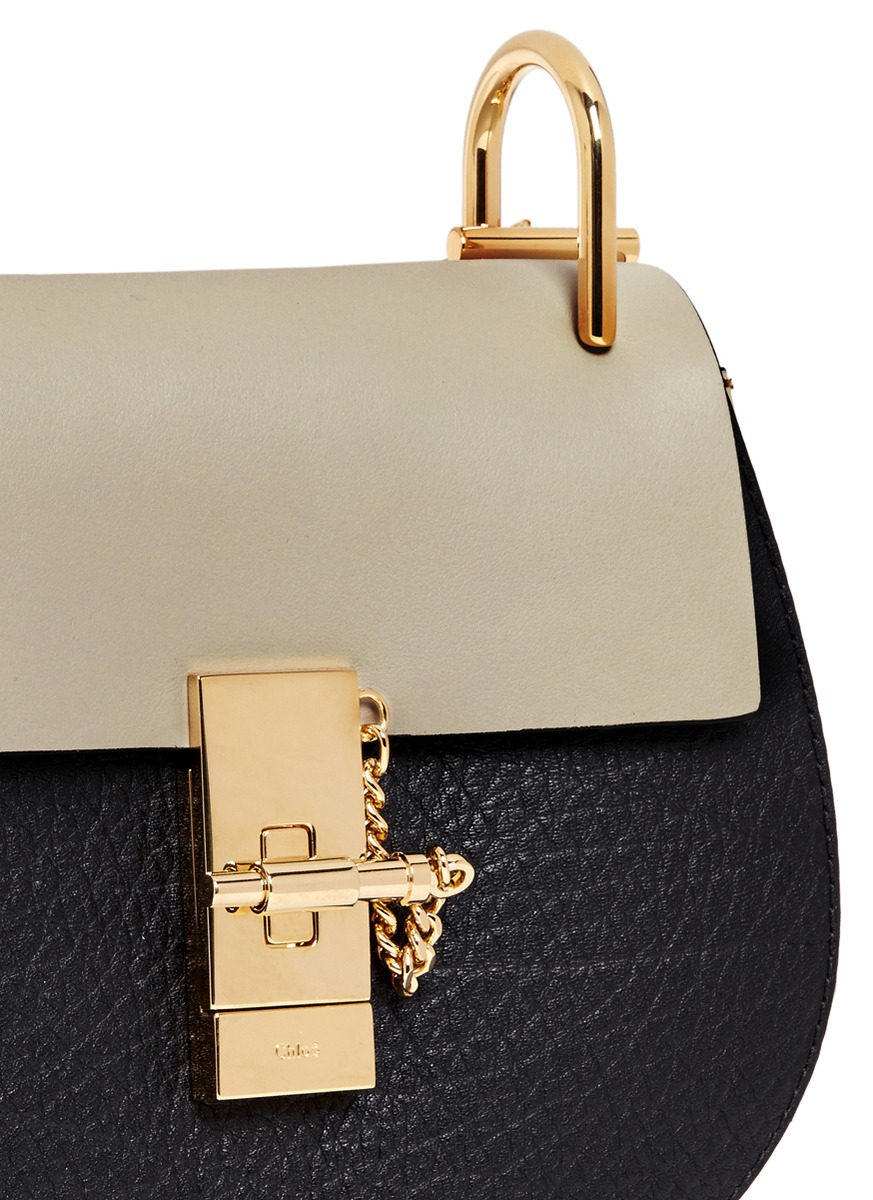 hudson mini bag in smooth calfskin with studded fold leather  