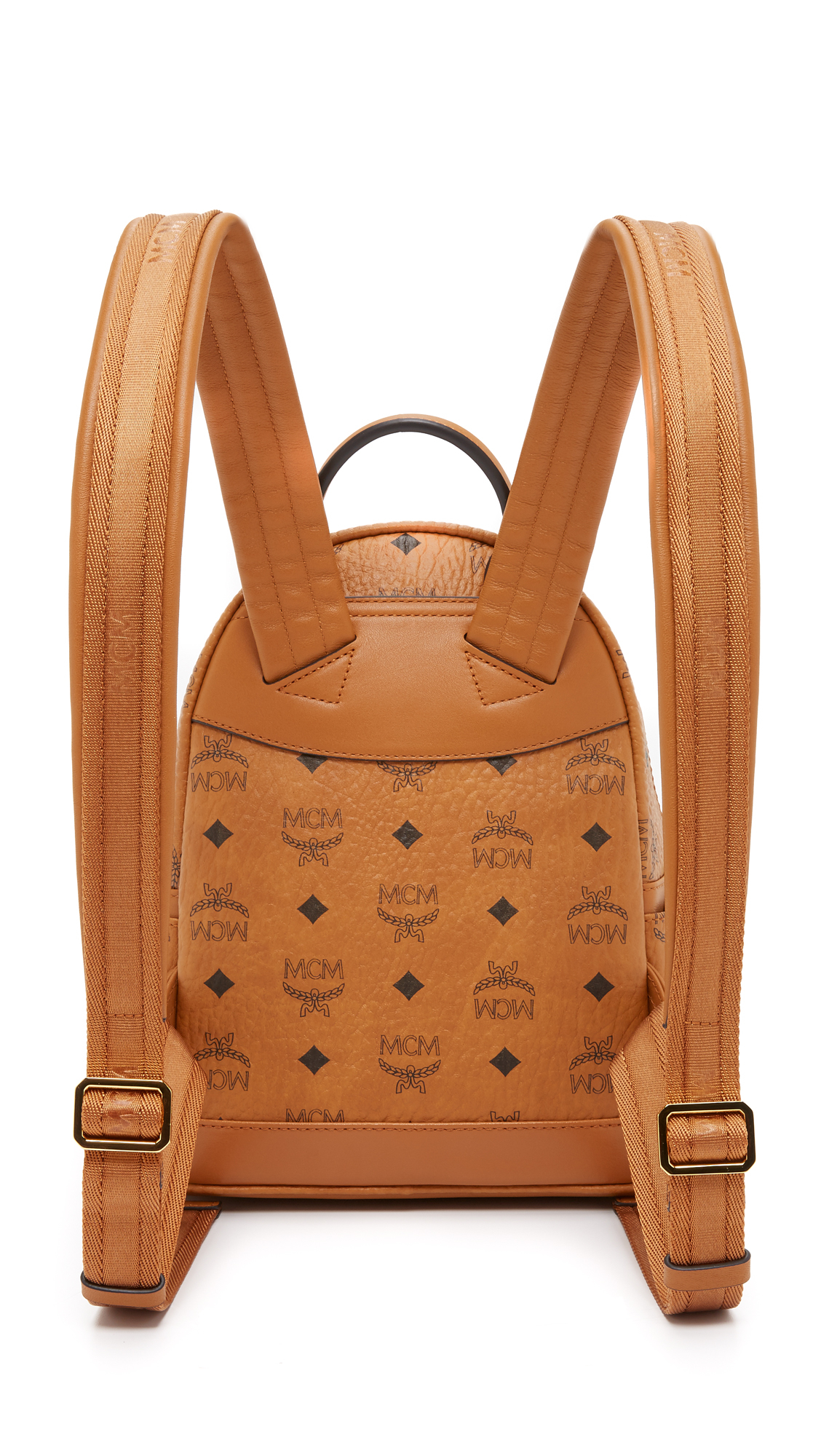 MCM Canvas Crystal Stud Baby Backpack in Cognac (Brown) - Lyst