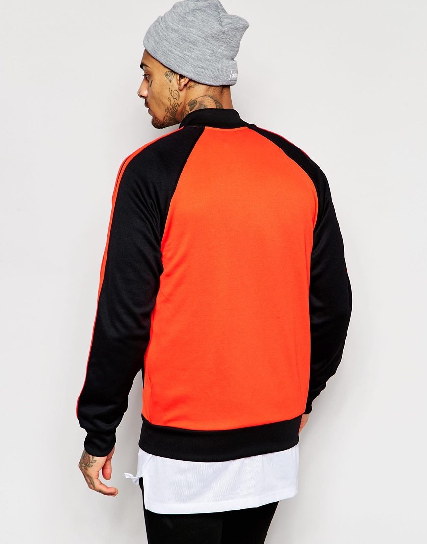 black and orange adidas track jacket