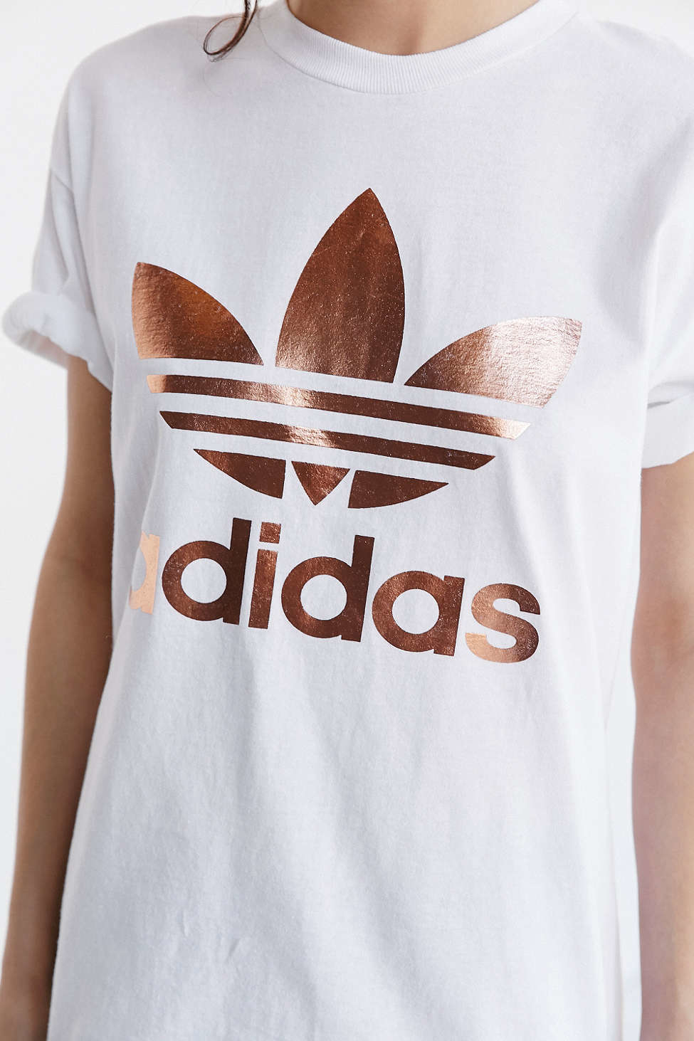 gold and white adidas shirt