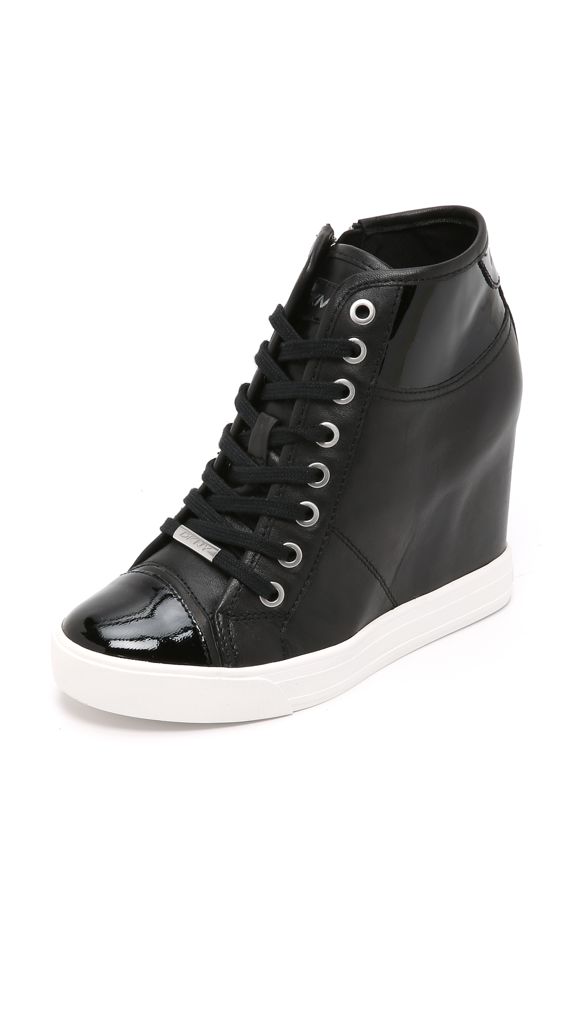DKNY Leather Grommet Zip Wedge Sneakers in Black - Lyst