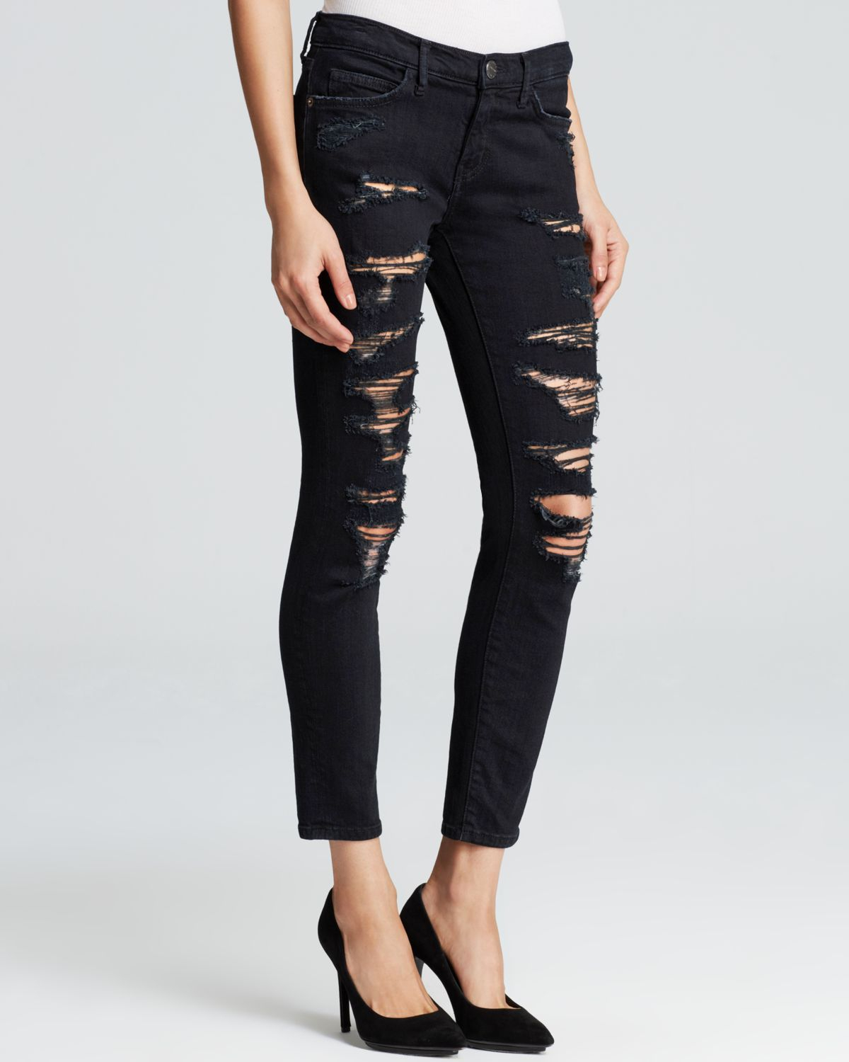 tattered black jeans