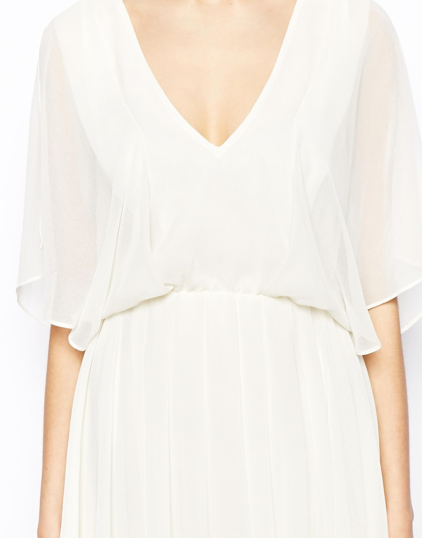 white angel sleeve dress