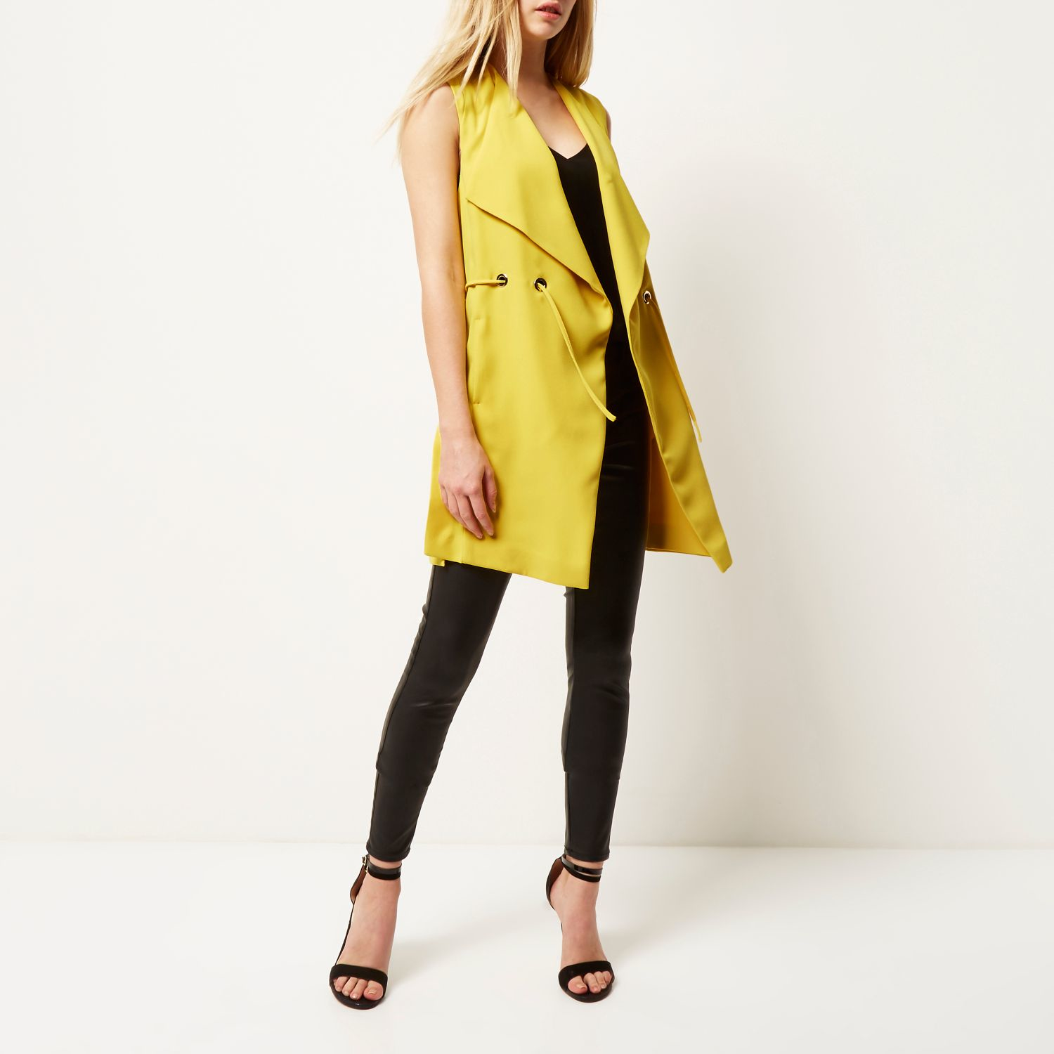 yellow sleeveless jacket