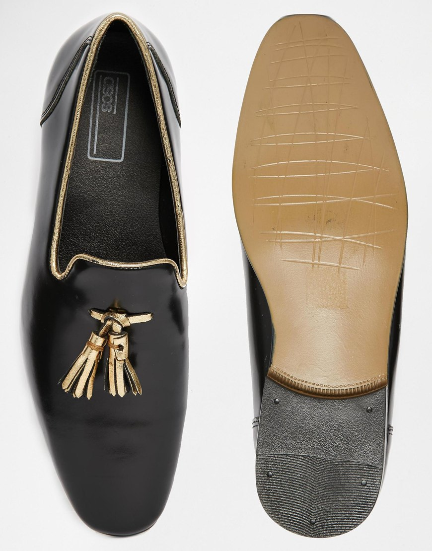black loafers with gold tassels