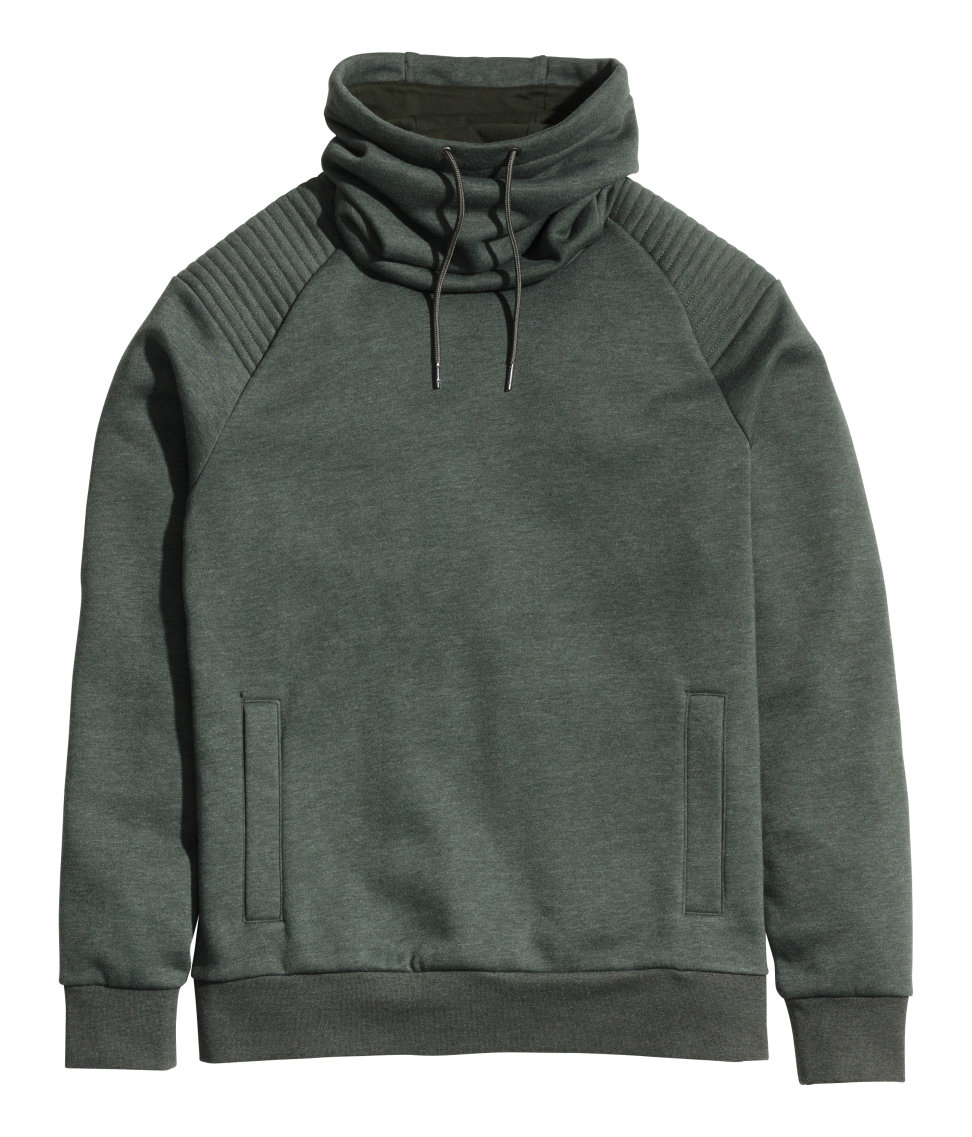 green sweatshirt with white collar