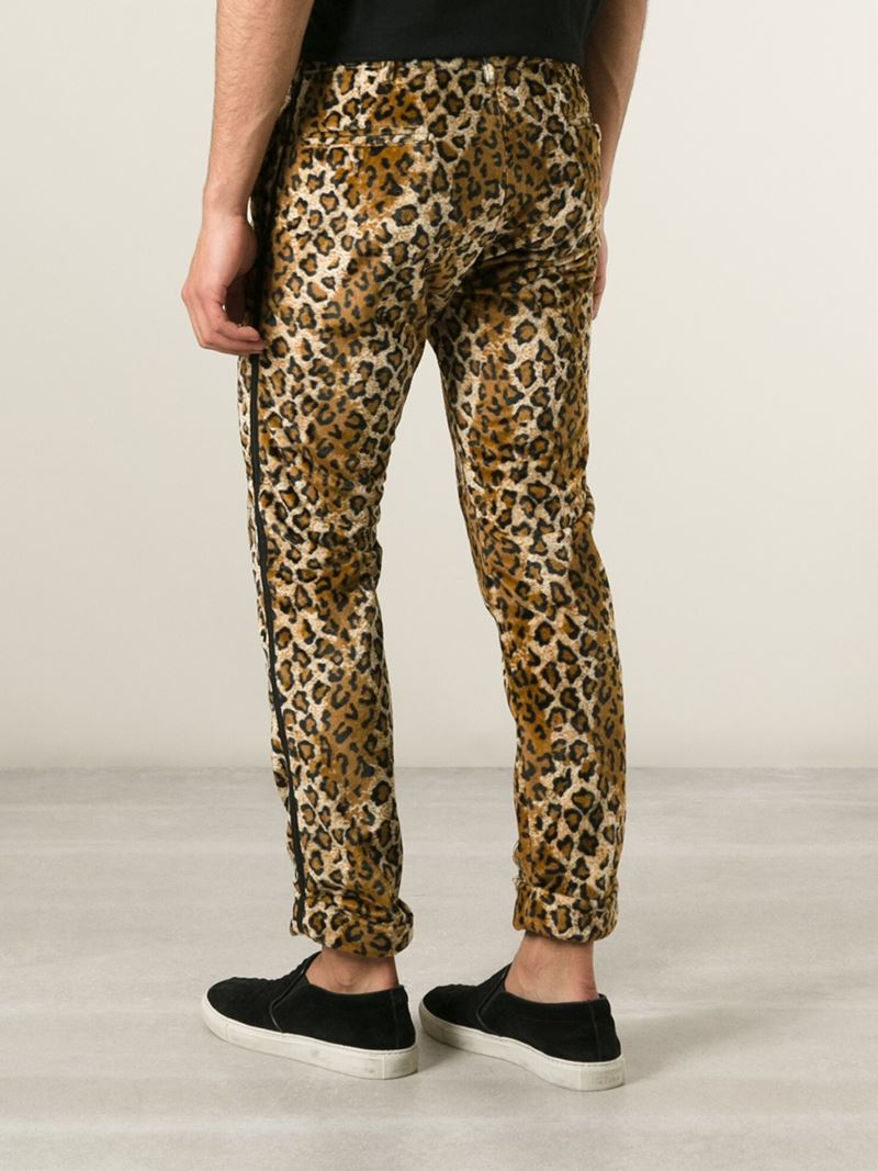 leopard print trousers with red stripe