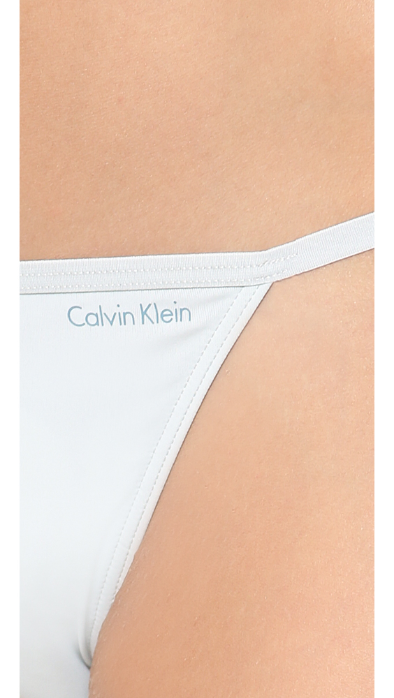 Calvin Klein Sleek String Bikini Briefs Cosmic in White | Lyst