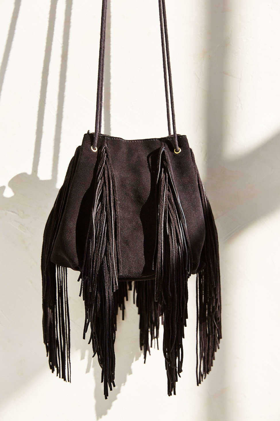 black fringe bucket bag