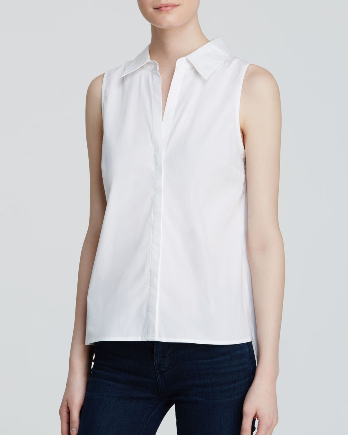 Sleeveless button down Look de Pernille. Tuck a crisp white button-down into an ultra-high waist skirt and finish it off with a belt. Slip into a pair of pointed-toe heels to stay chic and comfortable all day long.