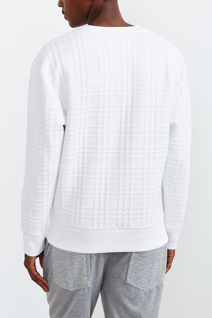 white quilted sweatshirt
