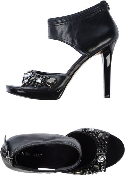 https://cdna.lystit.com/photos/6ffd-2015/01/31/nine-west-black-sandals-product-1-27476606-0-209601456-normal_large_flex.jpeg