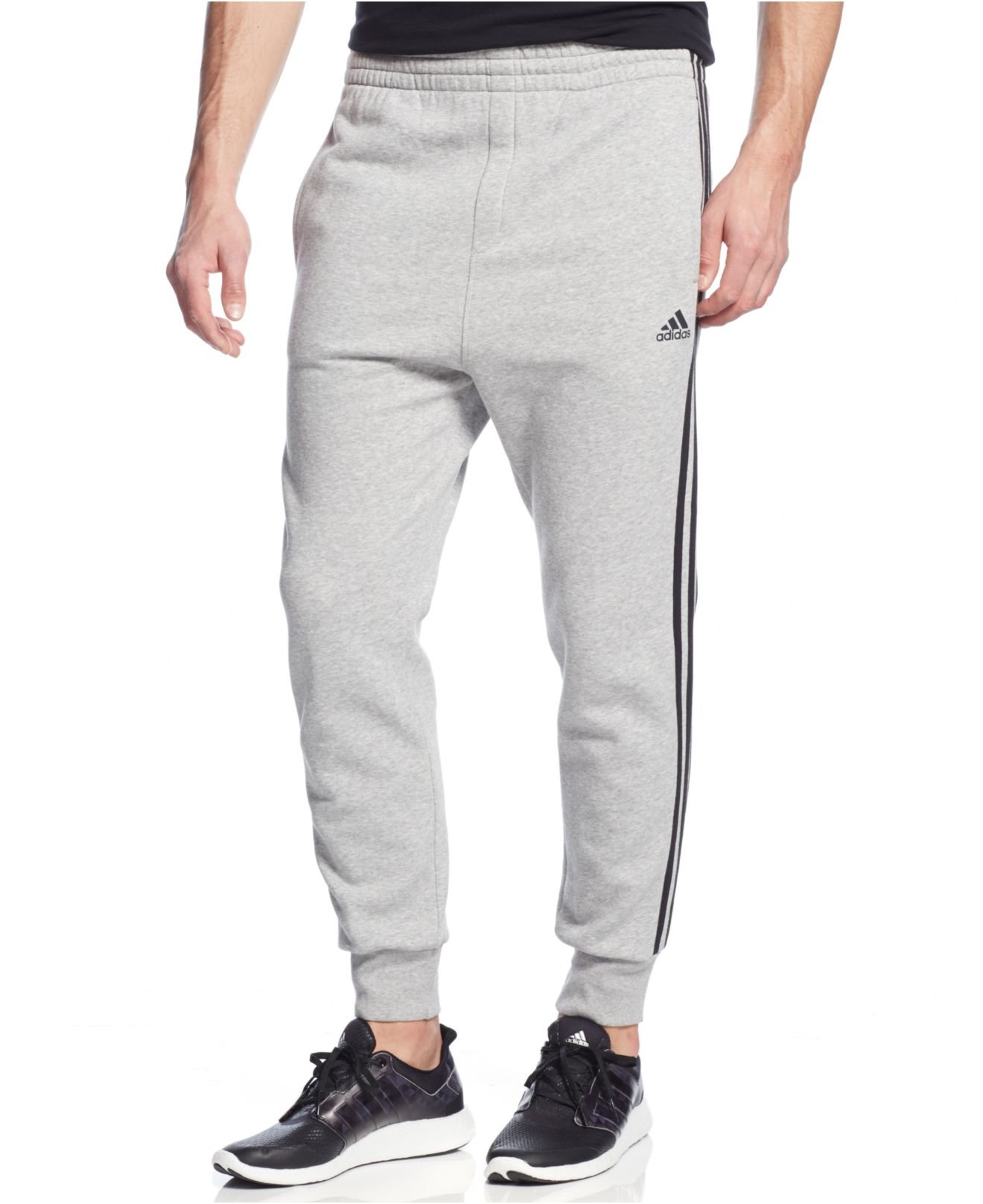 grey adidas sweatpants with black stripes