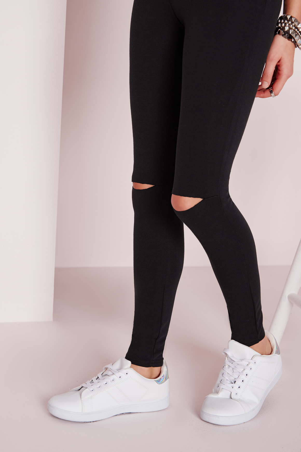 black pants with ripped knees