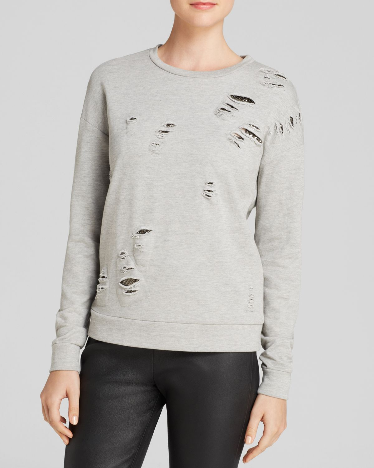 grey ripped sweater