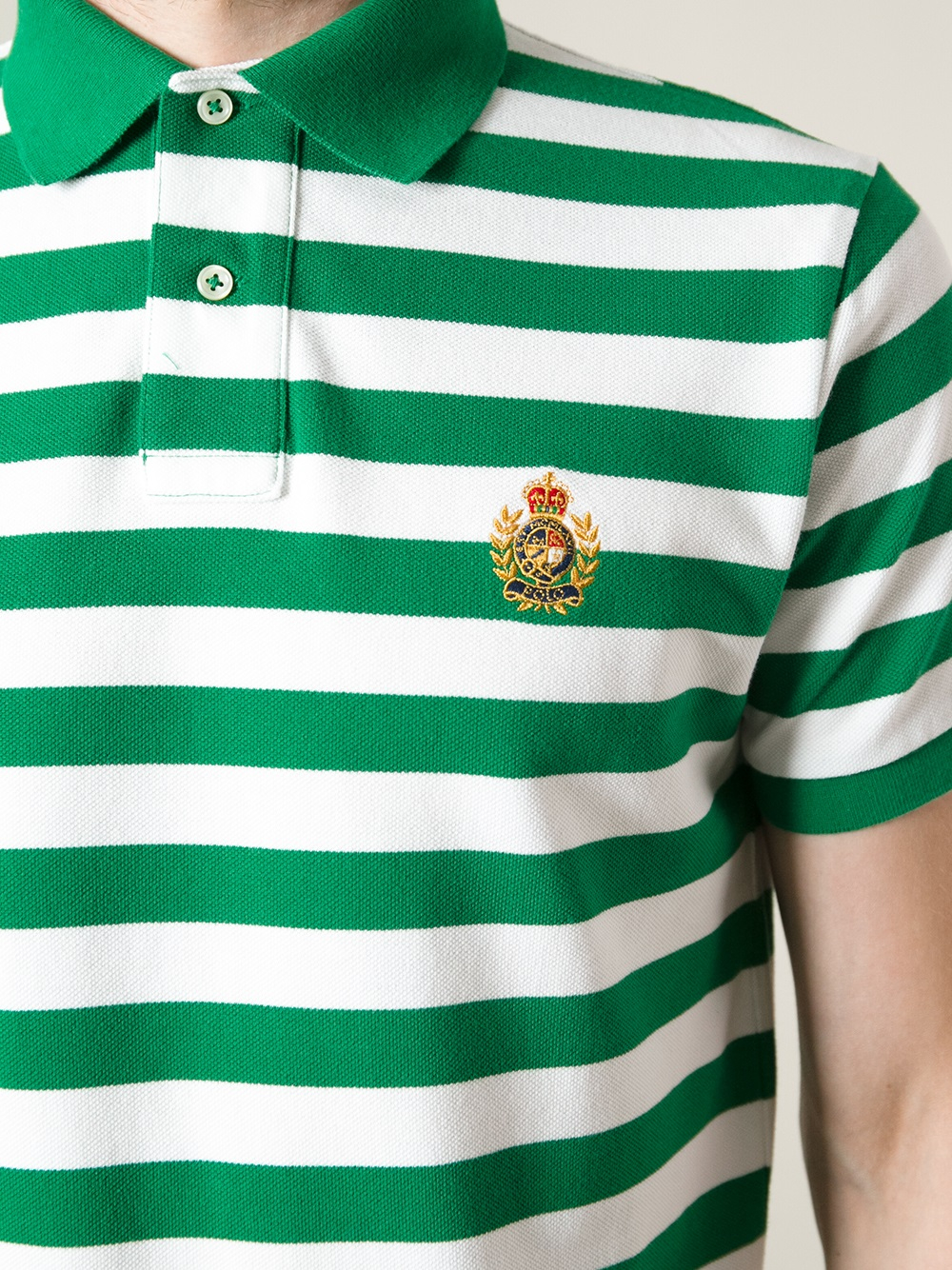 green and white striped polo shirt