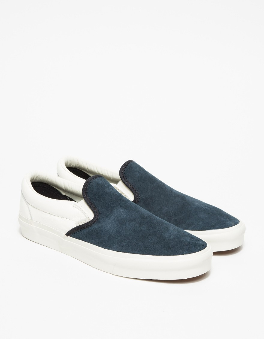 blue and white vans slip ons