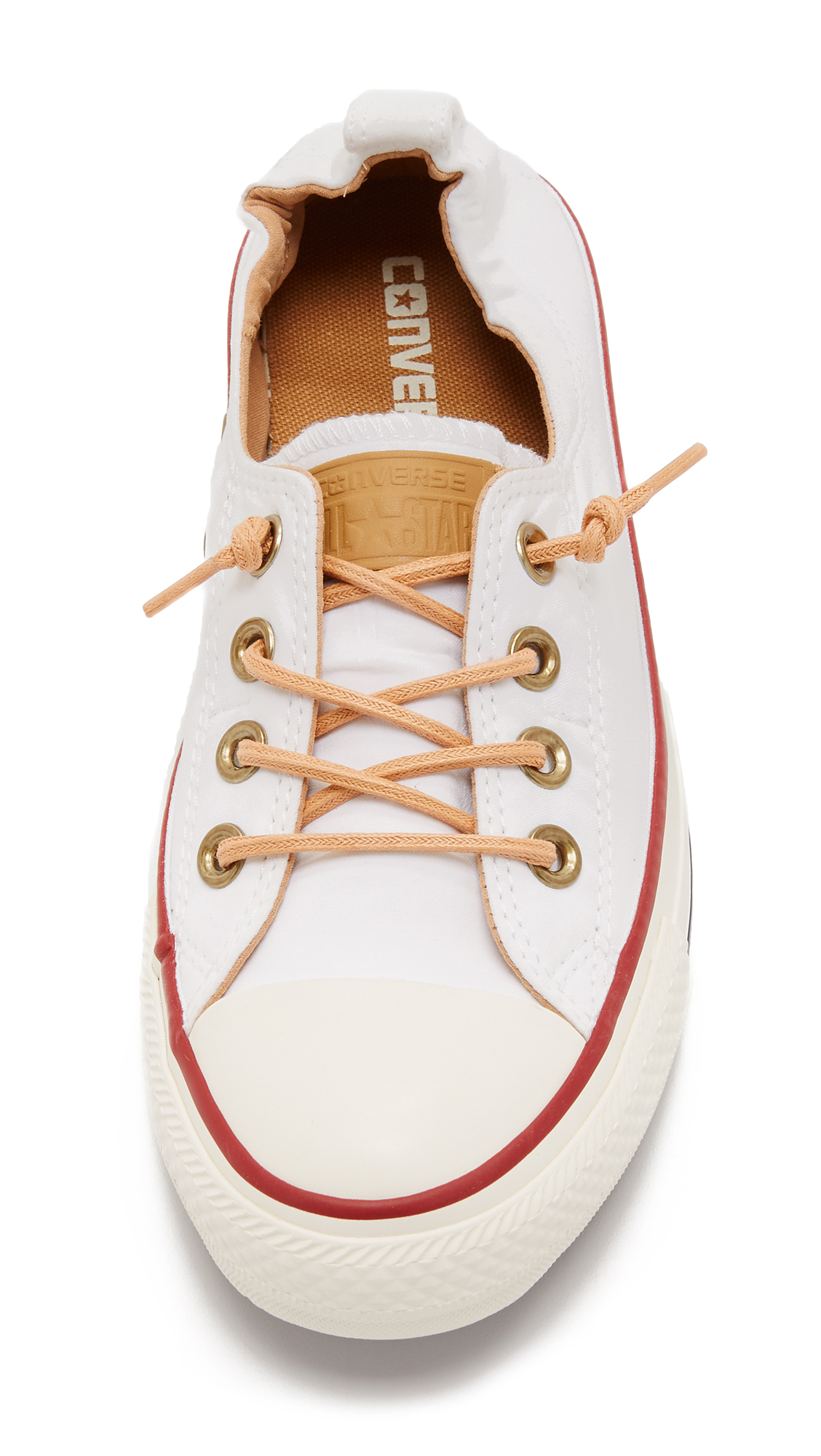 white converse with brown laces