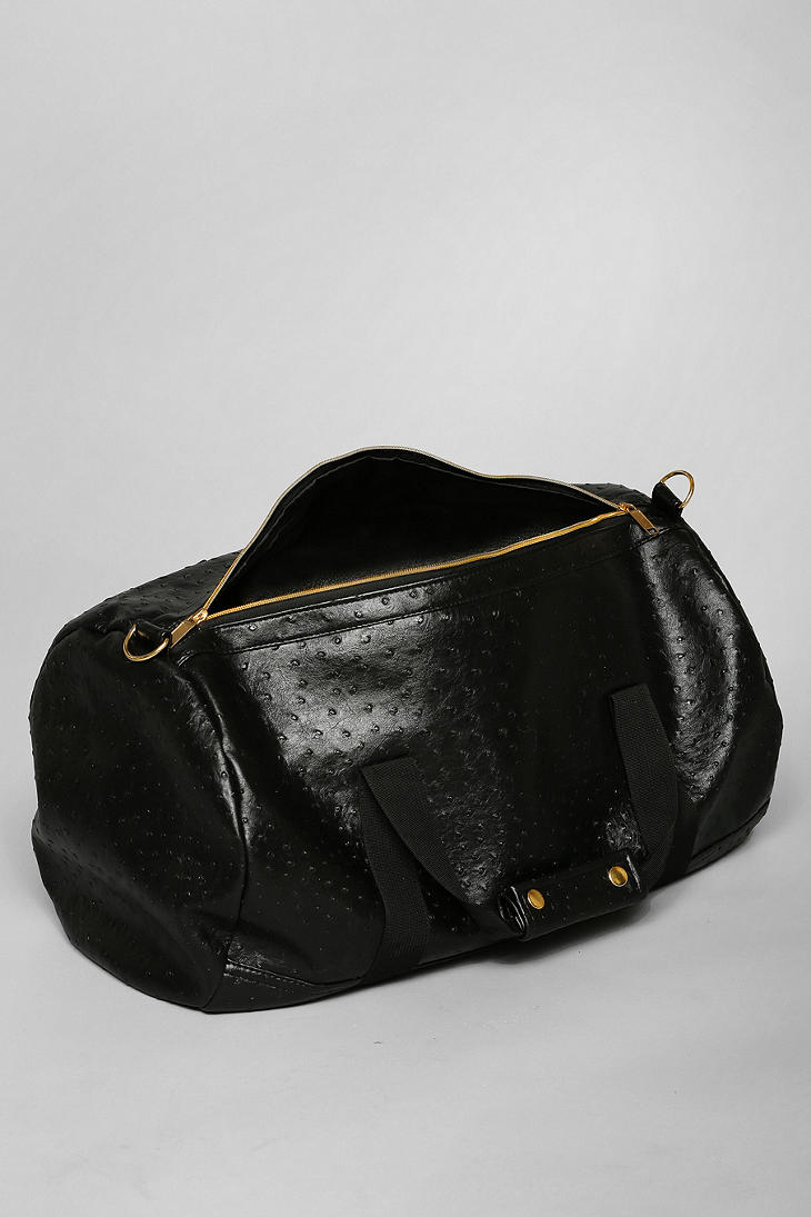 black and gold duffle bag