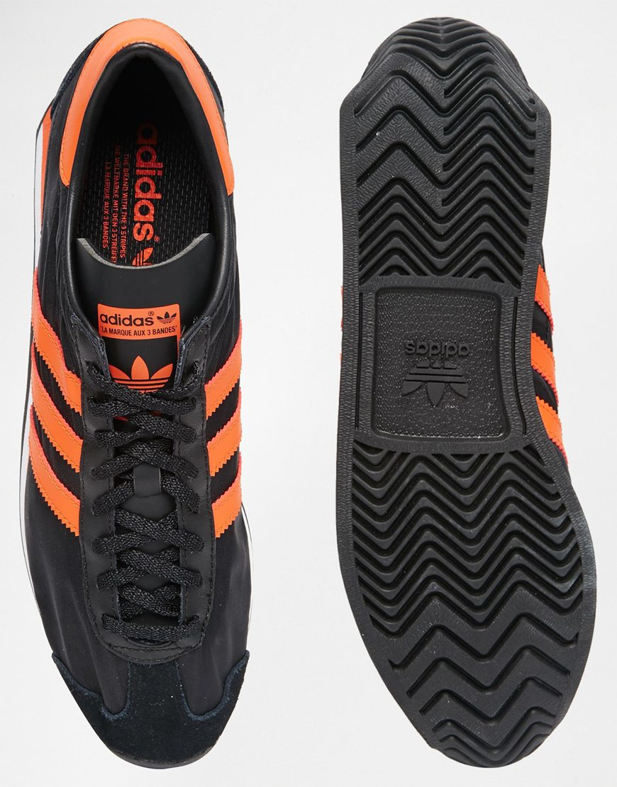 adidas shoes with orange stripes