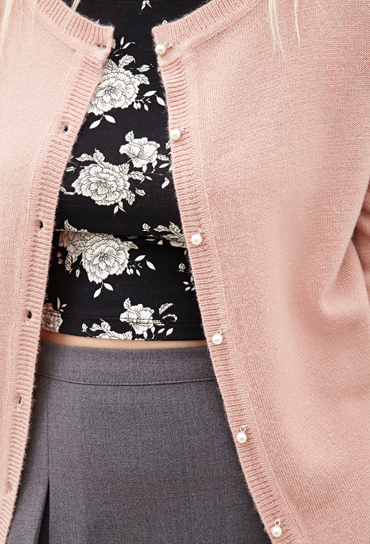 pink cardigan with pearl buttons