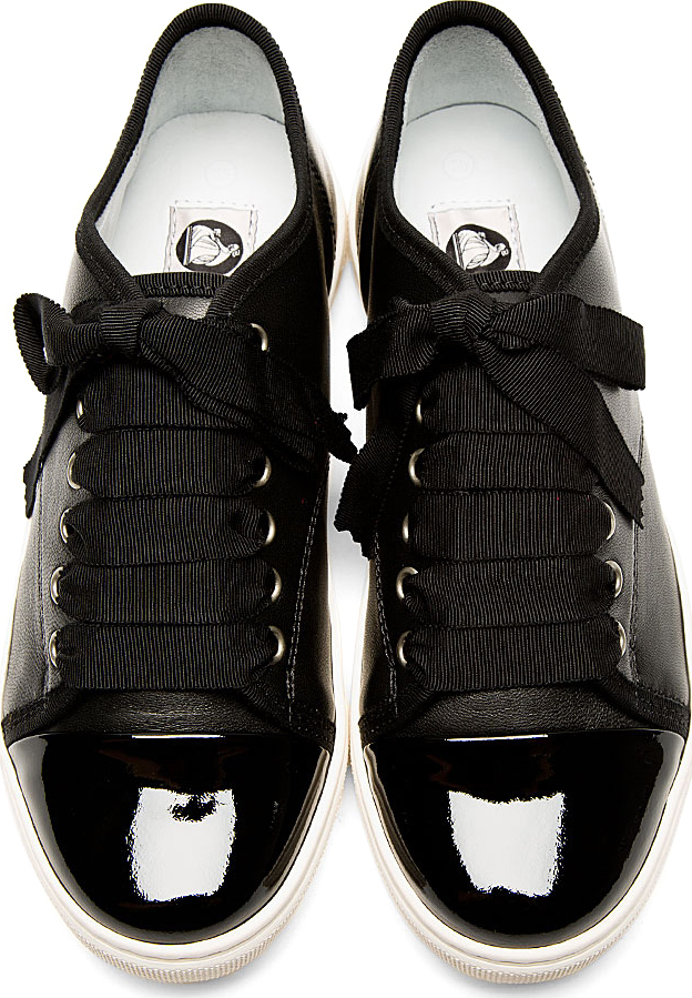 black trainers with ribbon laces