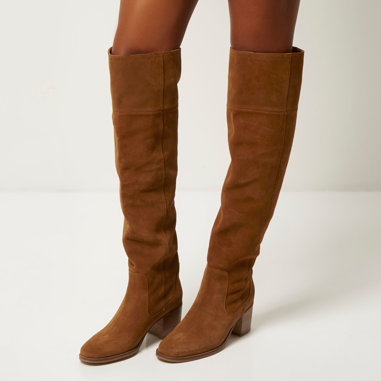 Buy > brown knee boot > in stock