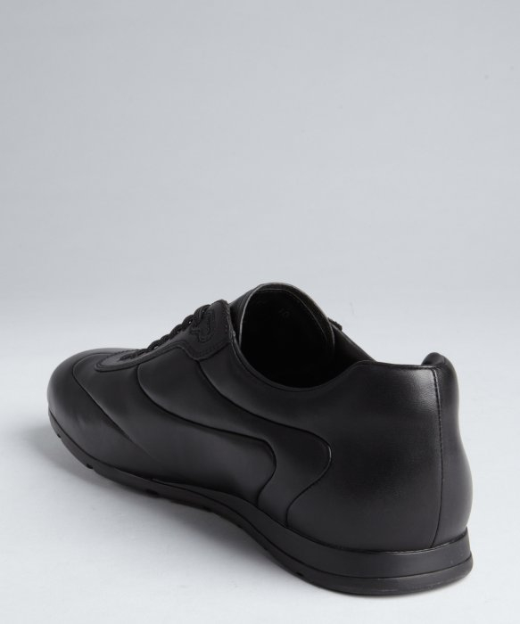 low profile black sneakers