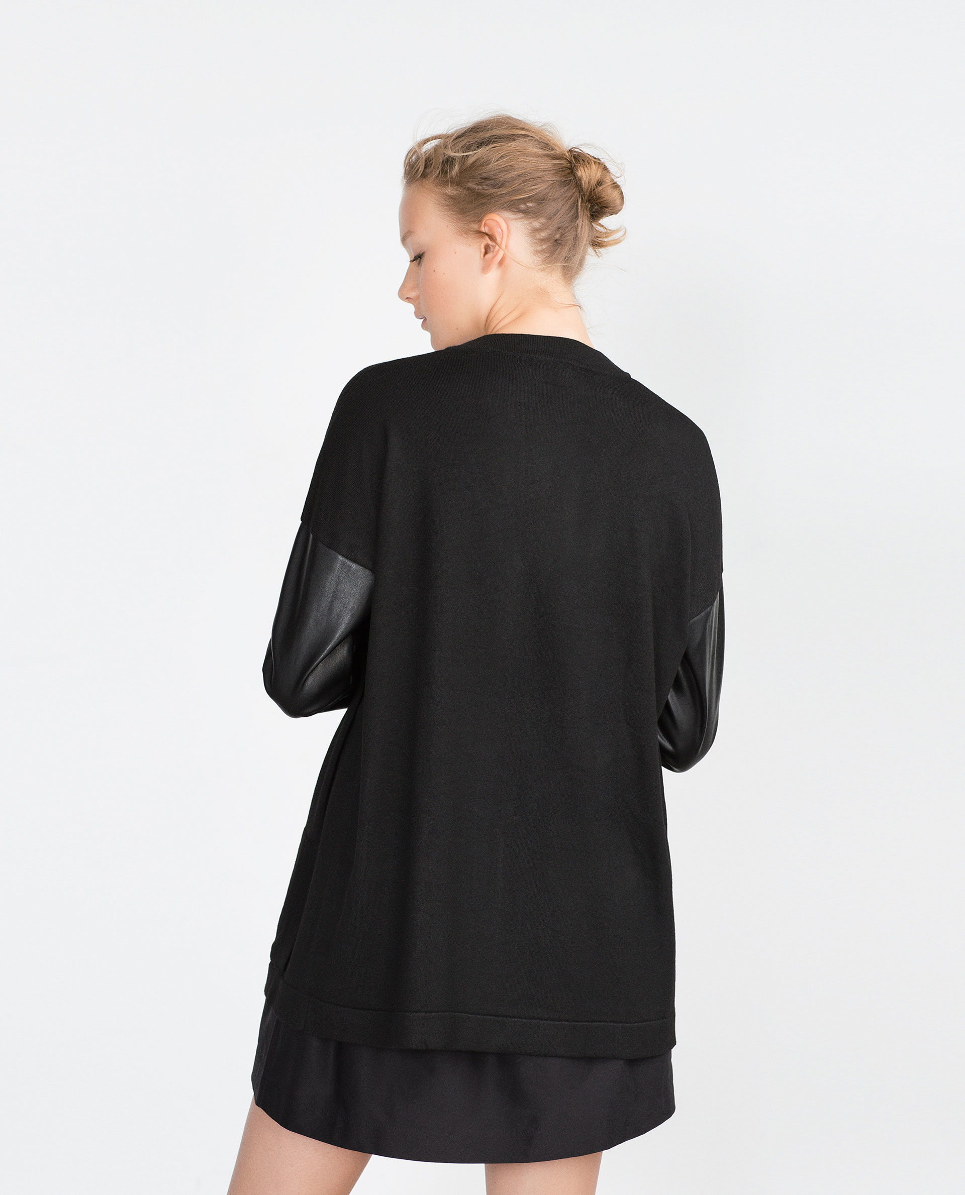 Not the type of blazer you'd wear to a 9 to 5; more like 5 to whenever! The black ponte body has a tailored look, with seaming detailed onto the draped front. The black faux leather sleeves lend an after-midnight vibe, with a sleek and smooth look.