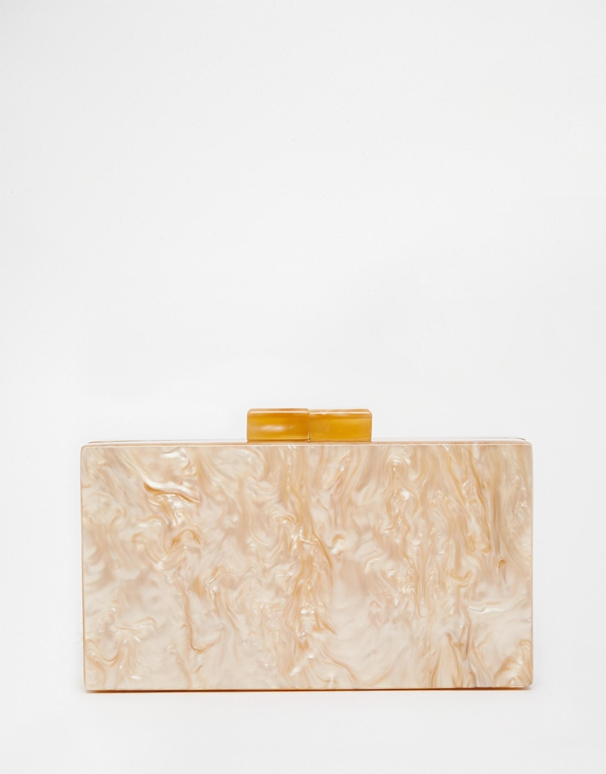 nude and gold clutch bag