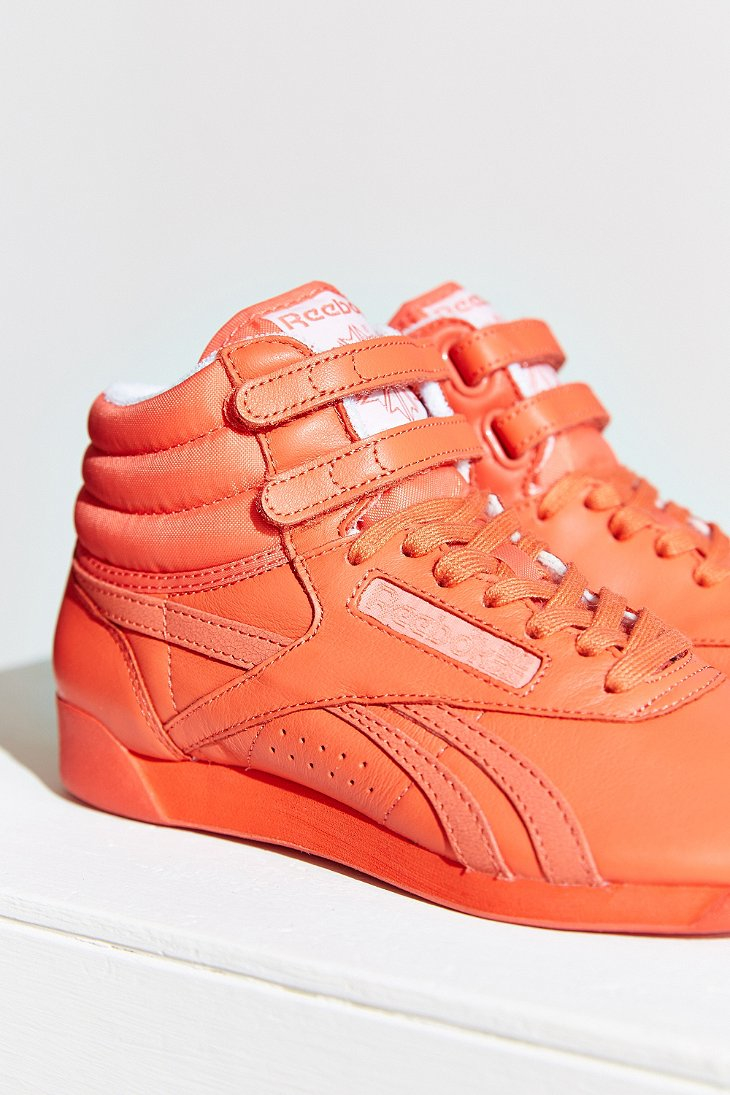 Reebok Freestyle Sneaker in Orange | Lyst
