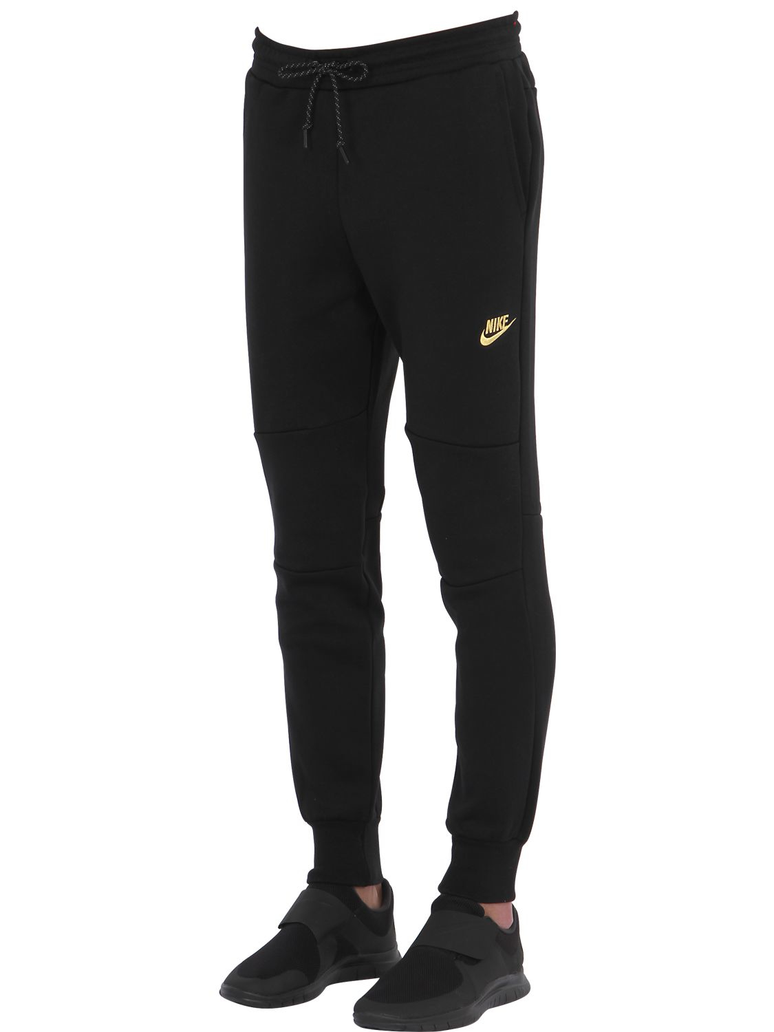 black and gold nike track pants