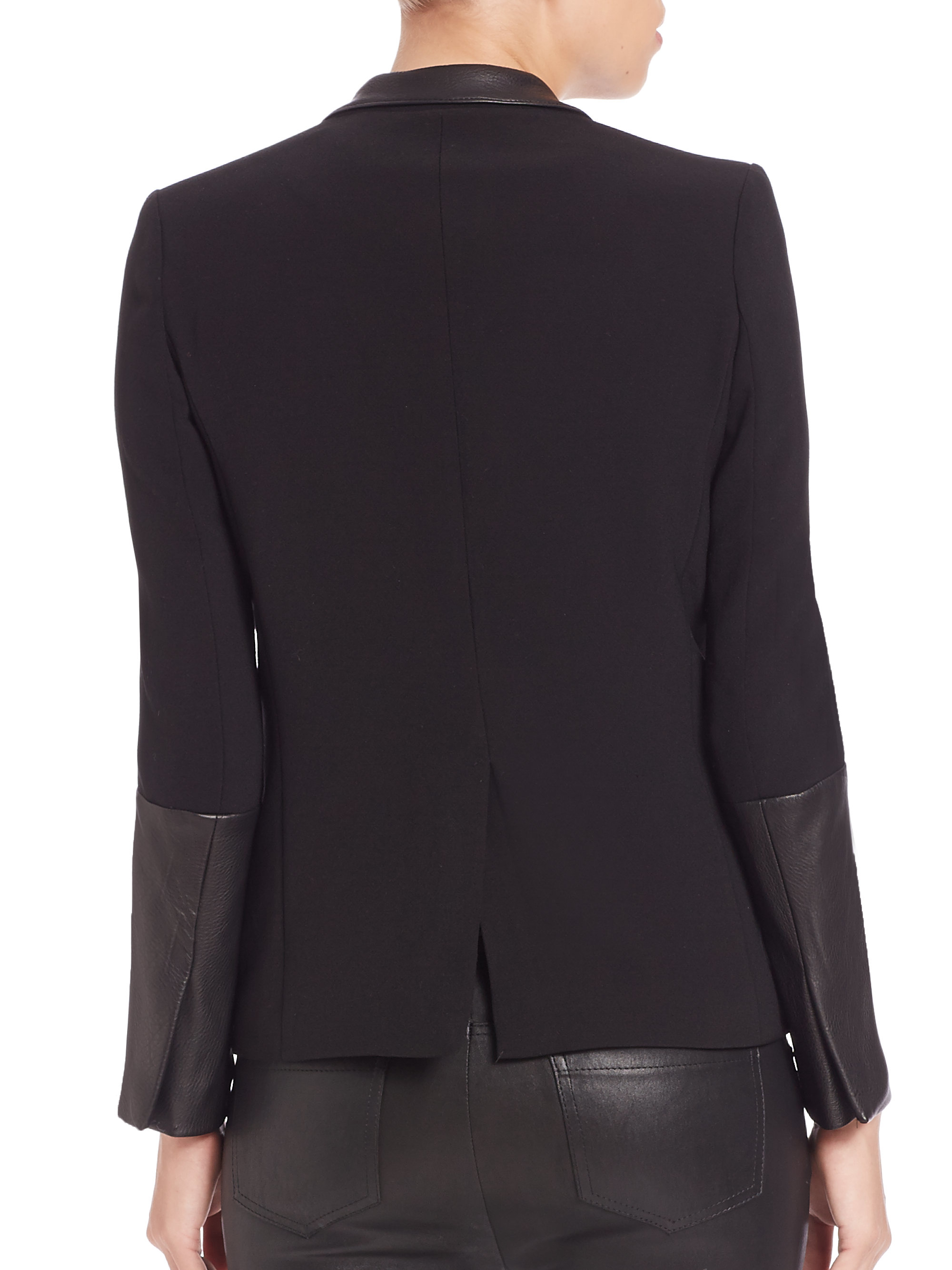 Follow The Elegant Bohemian Woven fabric Faux leather trim detail Long sleeve Open front Side zip pockets Our model wears a UK 8 and is cm/5'9
