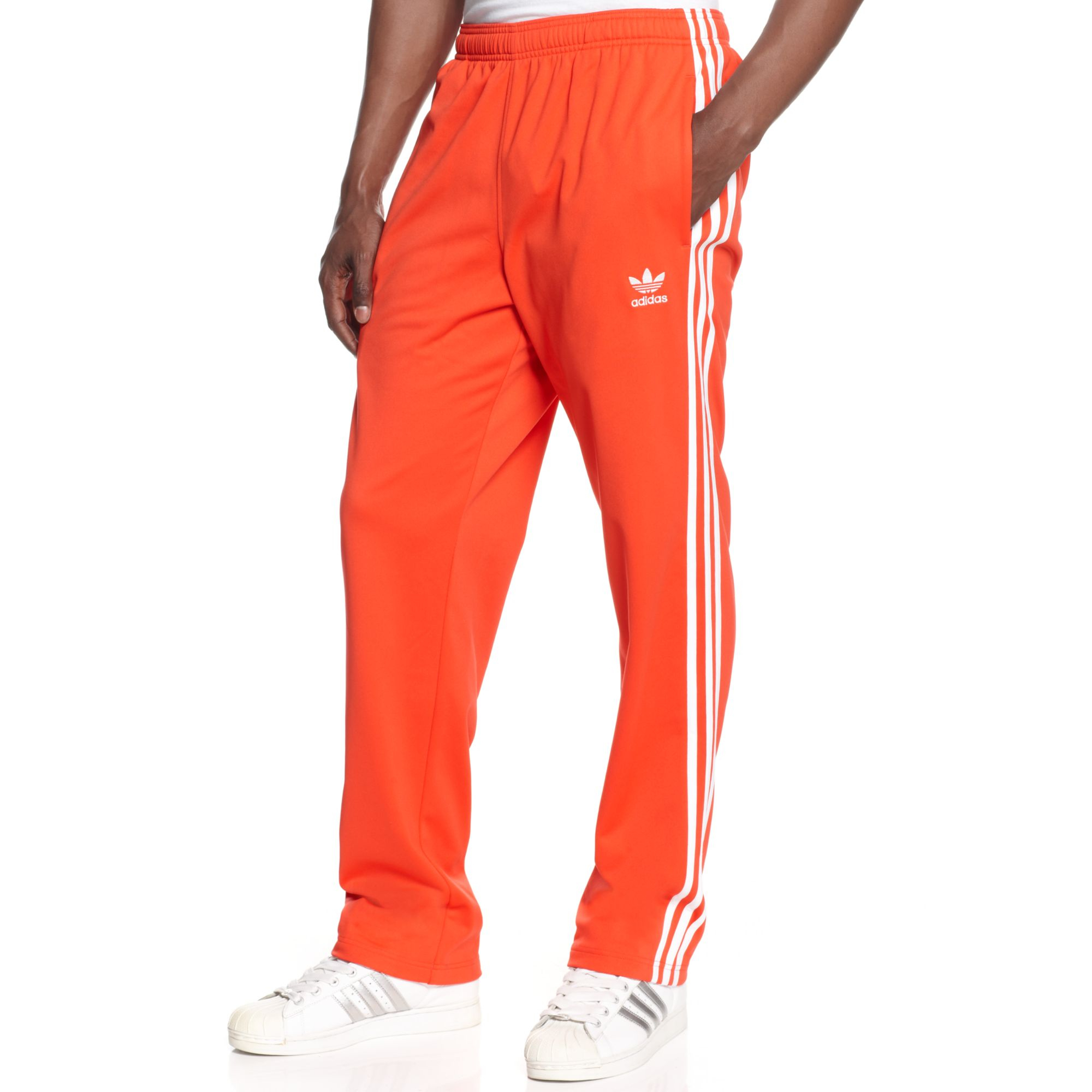 white and red adidas track pants